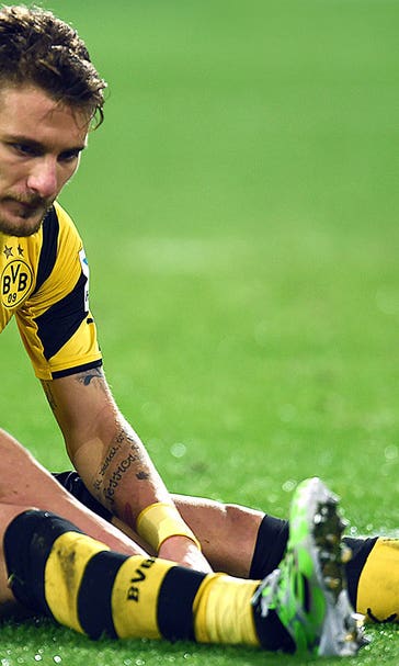 Wolfsburg salvage point at Dortmund; Gladbach climb to third